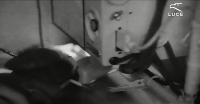 On-board radiotelegraphist using the key. Taken from the film Luce.